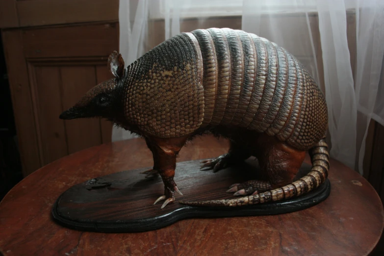 a sculpture of a armadile on top of a table