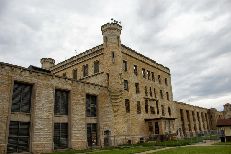 an old brick castle style building with several windows