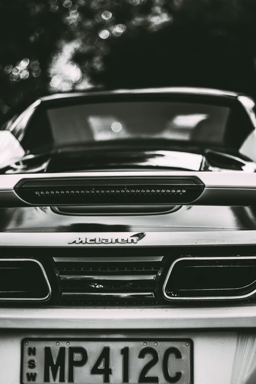 a black and white image of a car