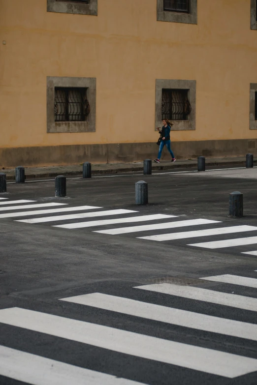 a person walking through the street with traffic