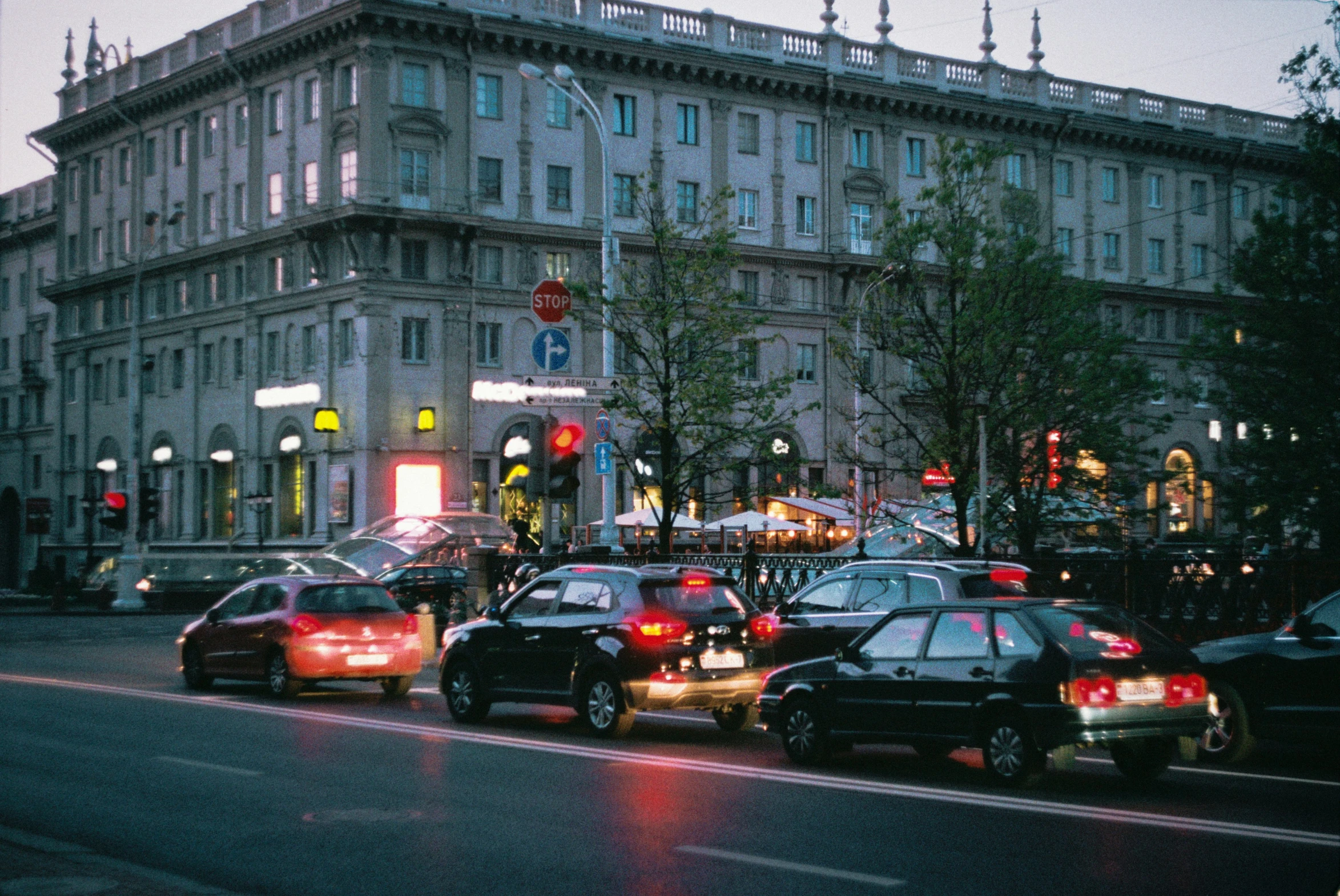 a street filled with traffic and lots of tall buildings