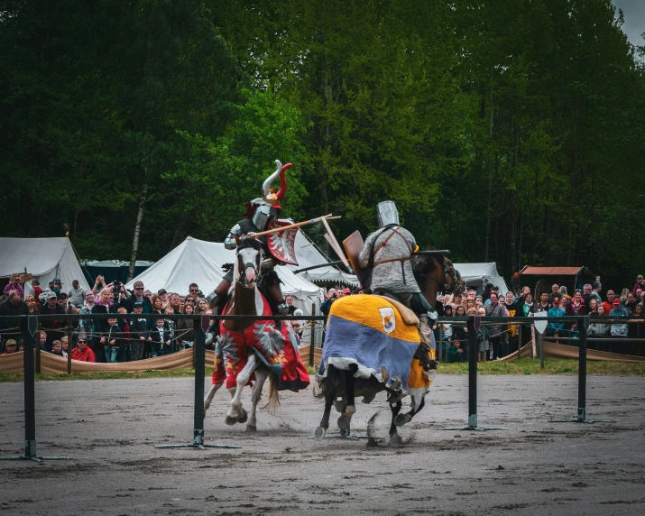 two knights being crushed and knocked over by a cart