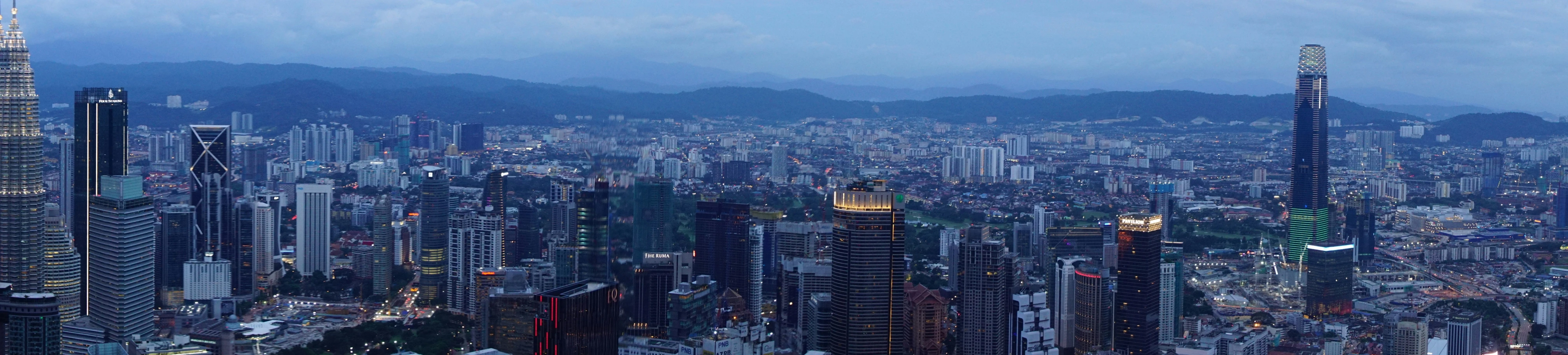 cityscape with many high rise buildings and lights