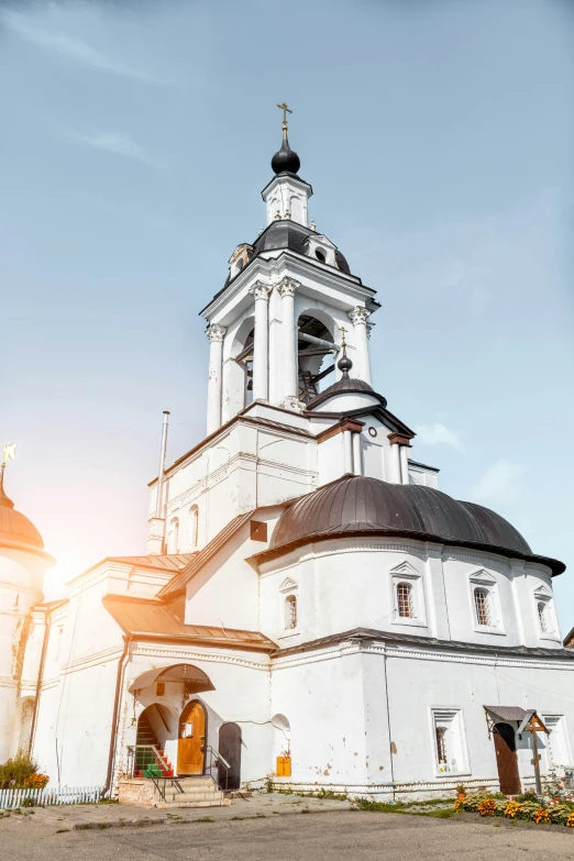 a large white church with a black roof