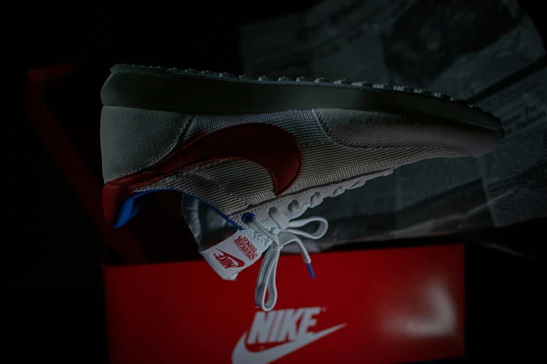 the nike air force 1 shoe is on the box
