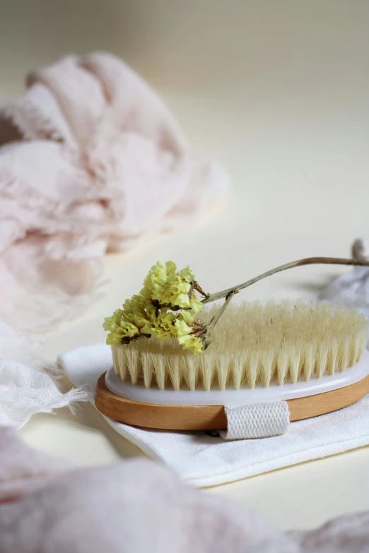 a close up of a brush on a white surface