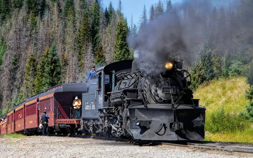 the train has a large steam engine coming up