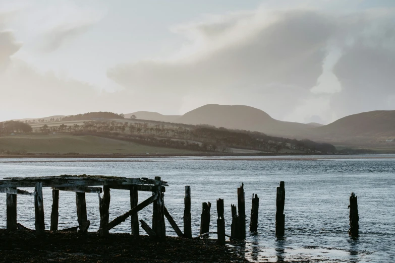 a lone boat sits at the end of the pier