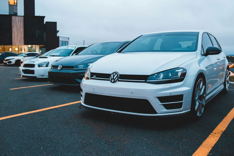 a row of cars parked in the parking lot