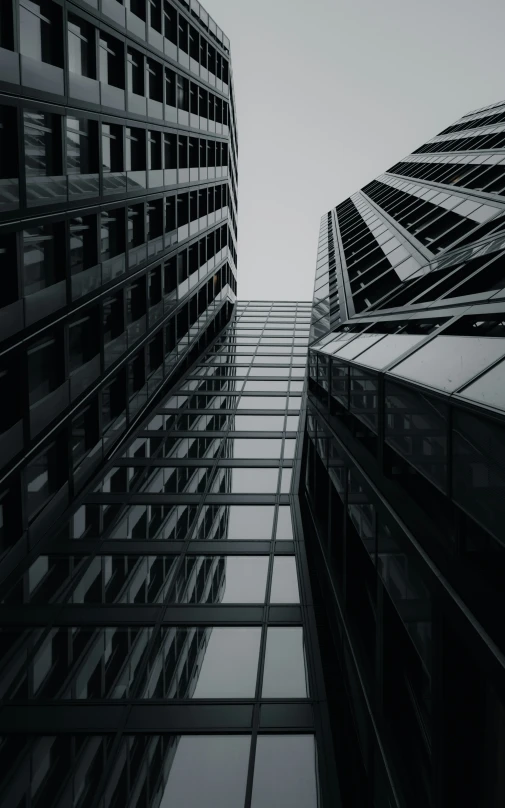 black and white image of a building with a sky background