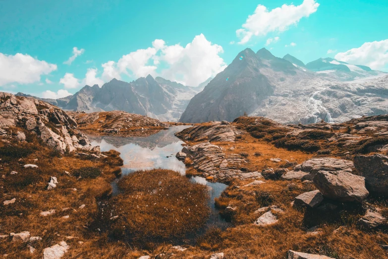 a lake is shown in a rocky area