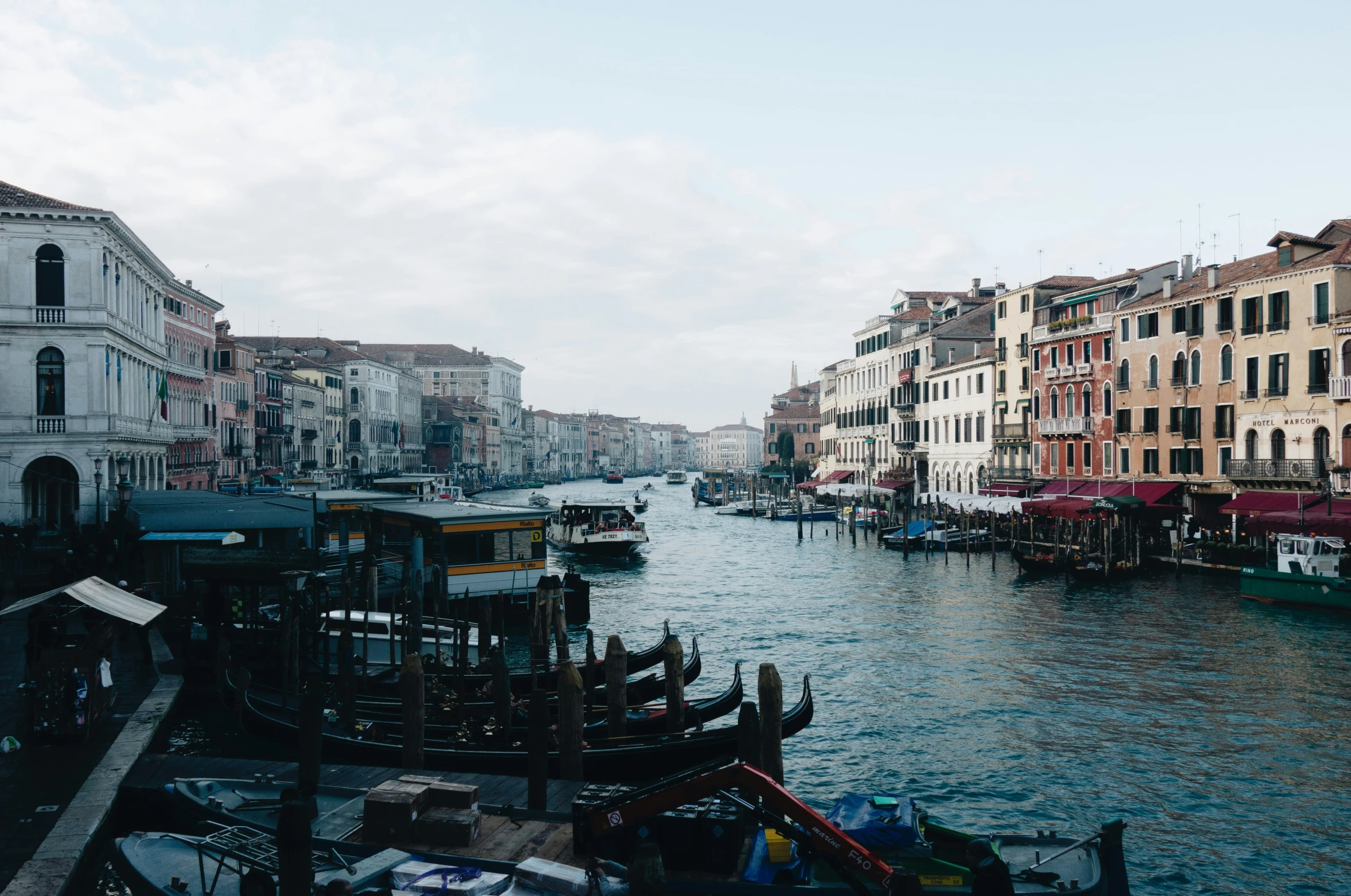 a waterway with a couple boats and buildings around it