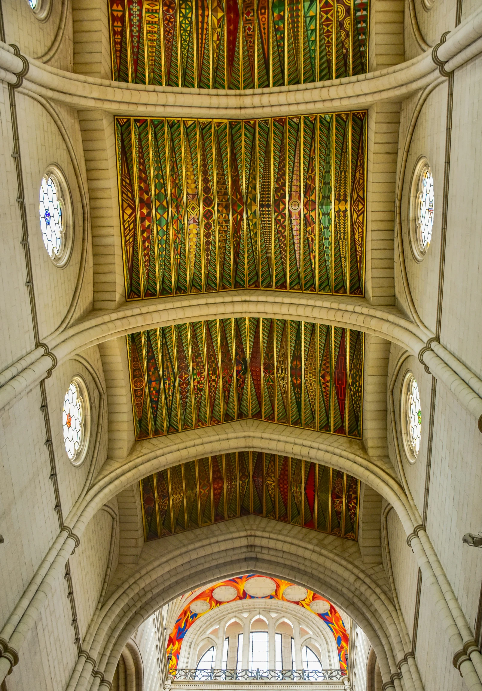 the ceiling inside of a building with several round lights