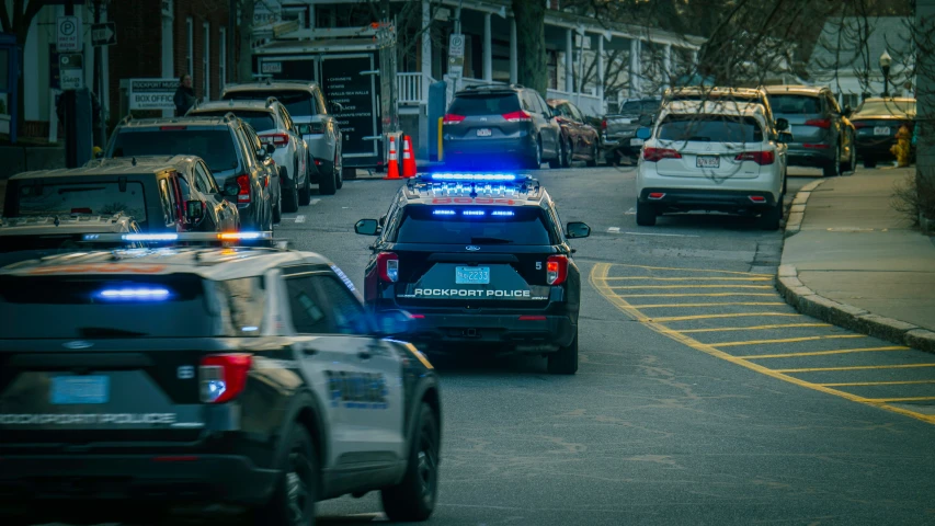 a police car is stopped on the side of the street