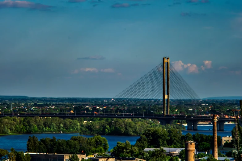 the view from the top of a tower with a bridge behind it