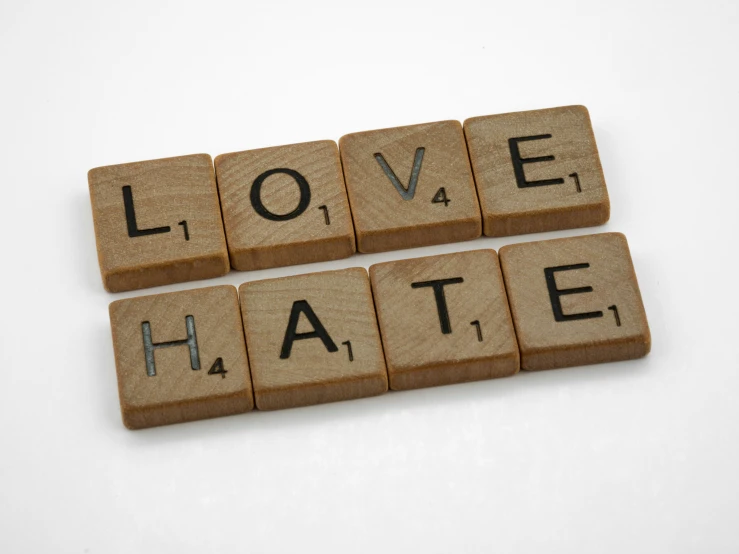 the word love hate spelled with wood blocks