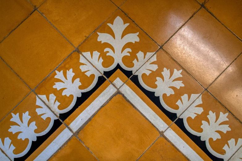 an artistic tile design in a kitchen floor