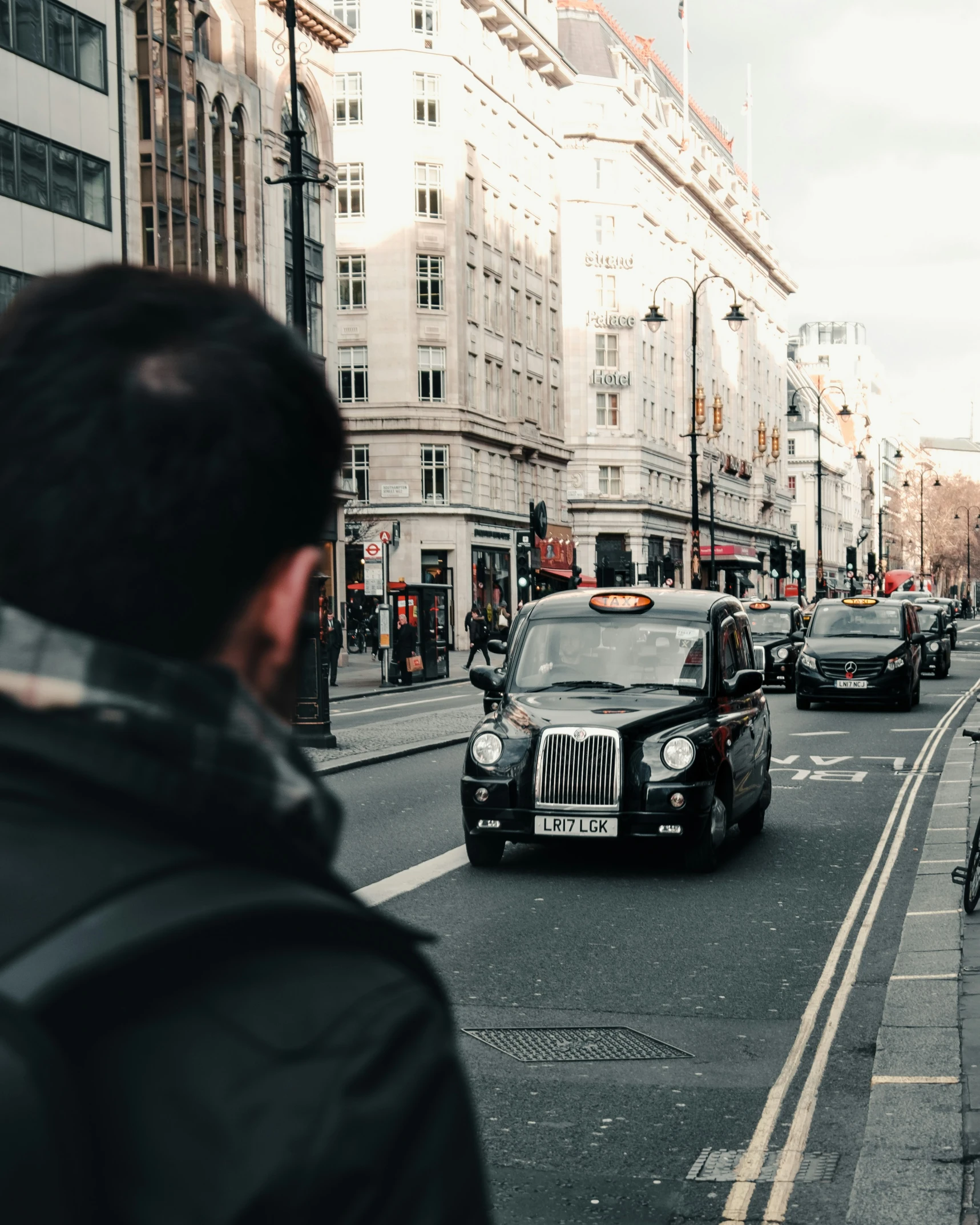 a group of cars parked on the street