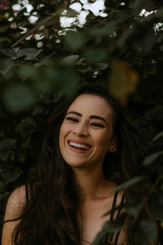 a woman smiling and posing for the camera