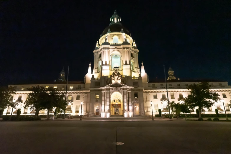 a large building at night with lights in the windows