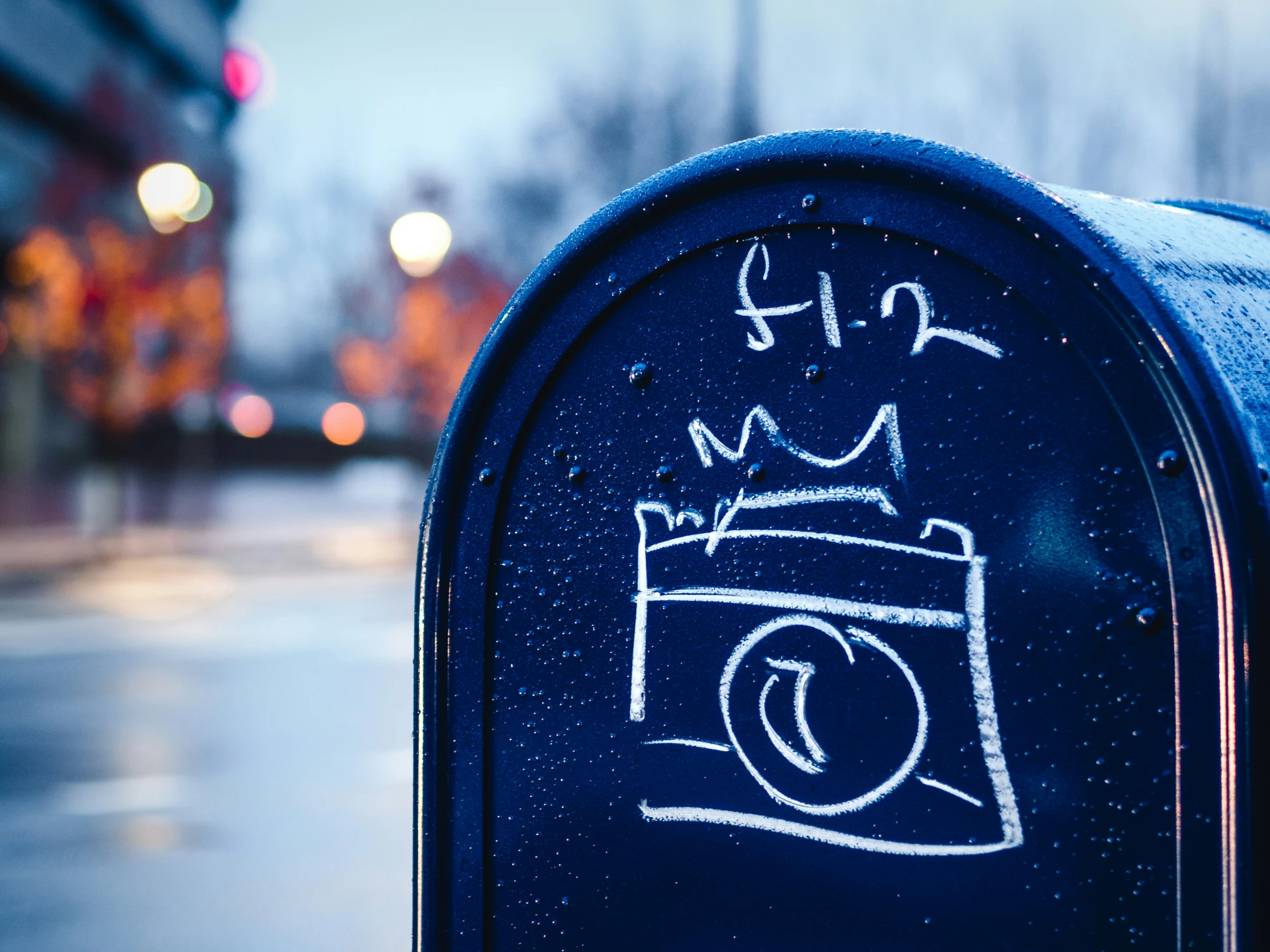 graffiti drawn on a mailbox, in the city