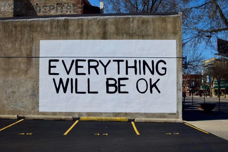 a sign that reads everything will be ok painted on the side of a building