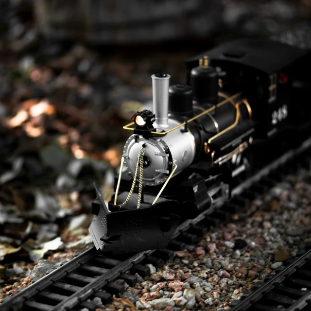 a close up of a toy train on the tracks