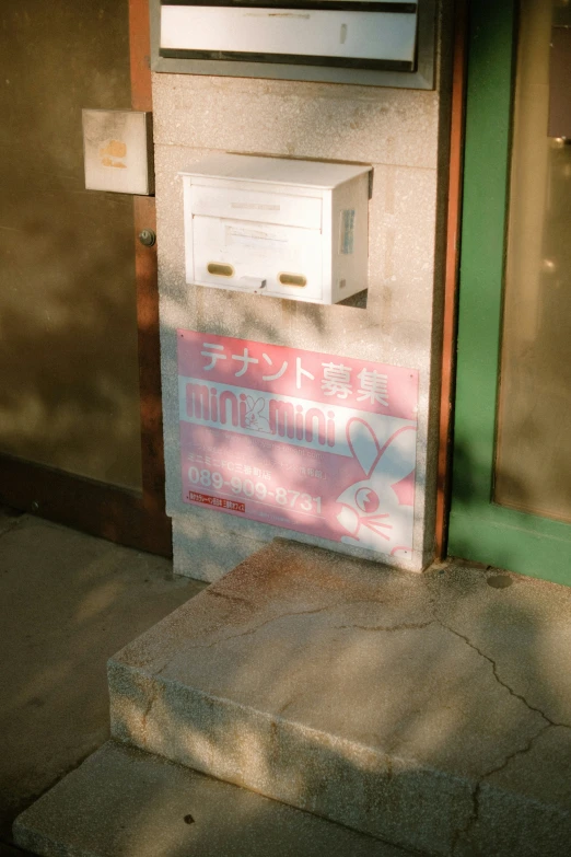 a mail box next to a sidewalk, on a street