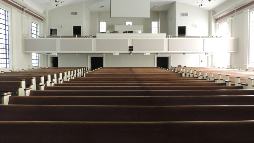 this is a big empty church with some pews