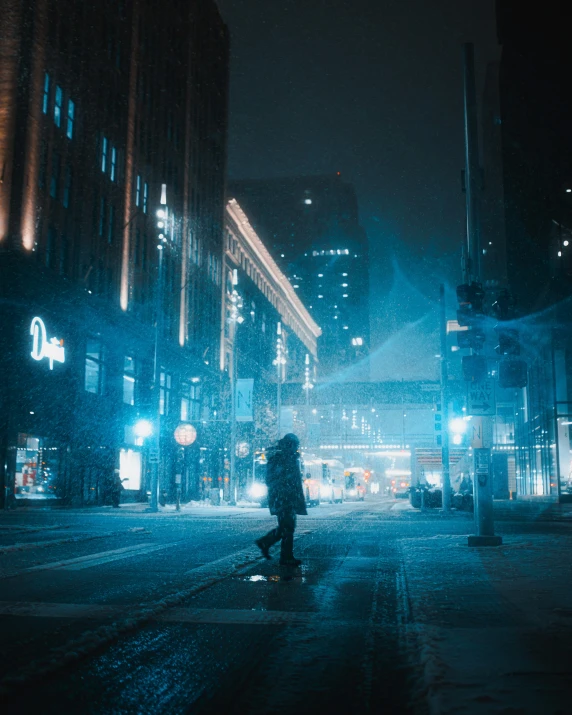 a person walking down a street at night