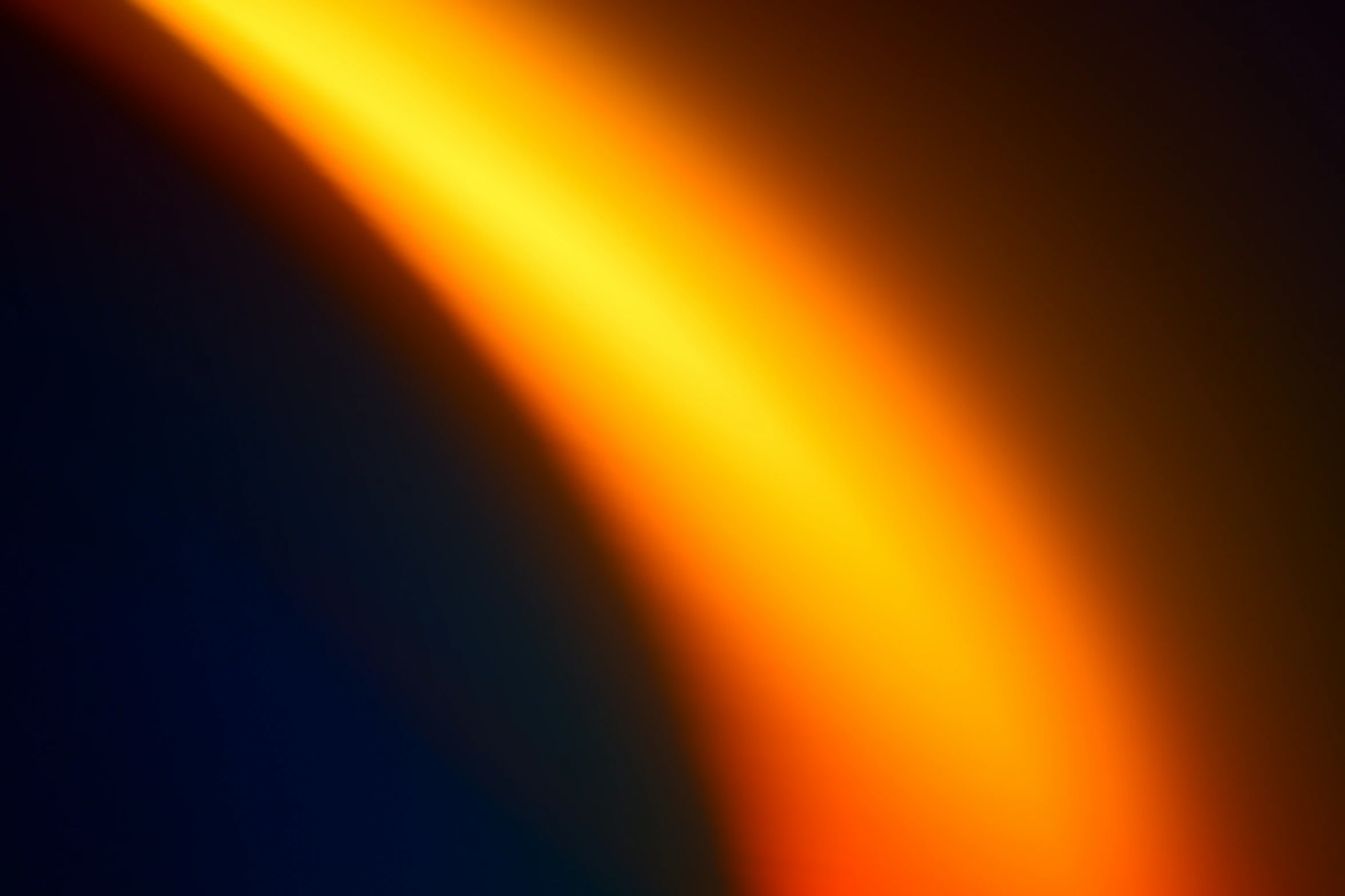 a blurry pograph of yellow and orange lighting