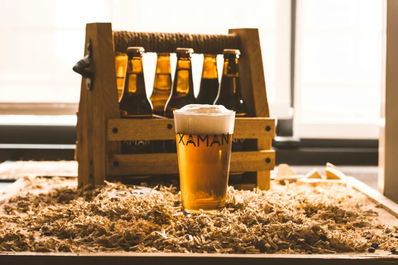 some beers in a glass on a table