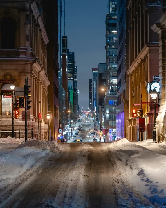 a city street that has a lot of snow on it