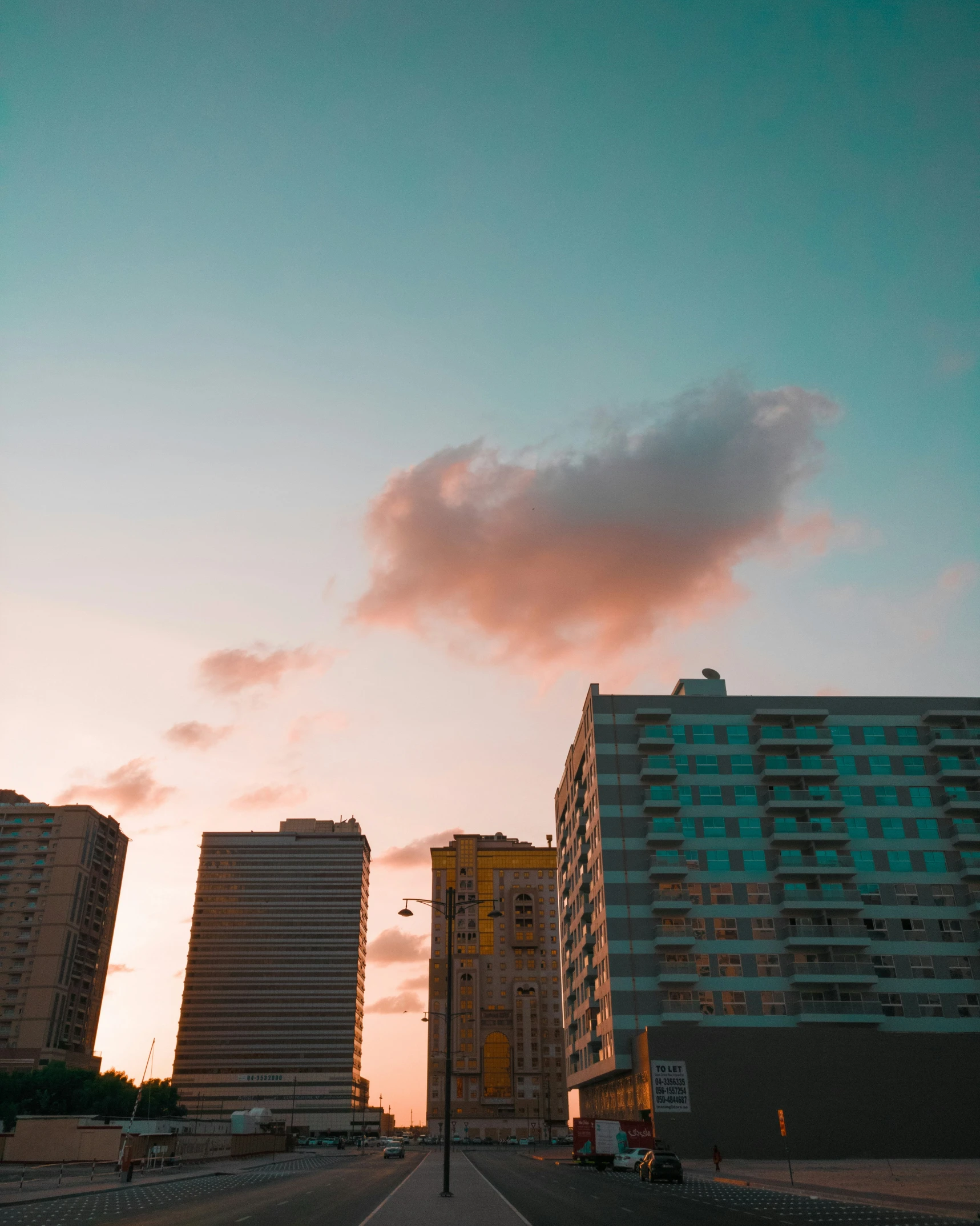 a view of the city skyline in the sunset