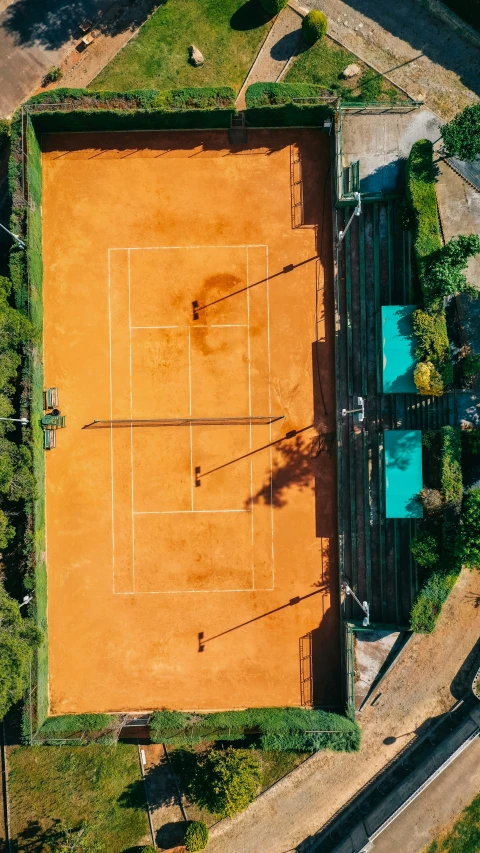 an overhead view of an outdoor tennis court