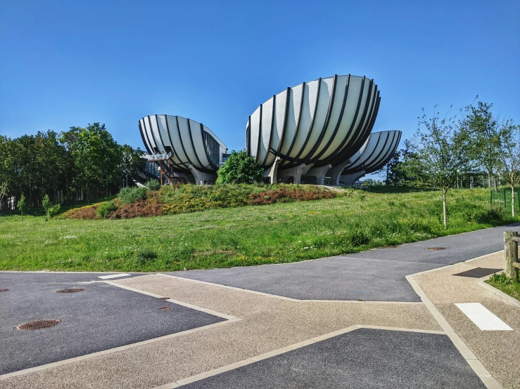 a very large boat shaped object sitting in the middle of a field