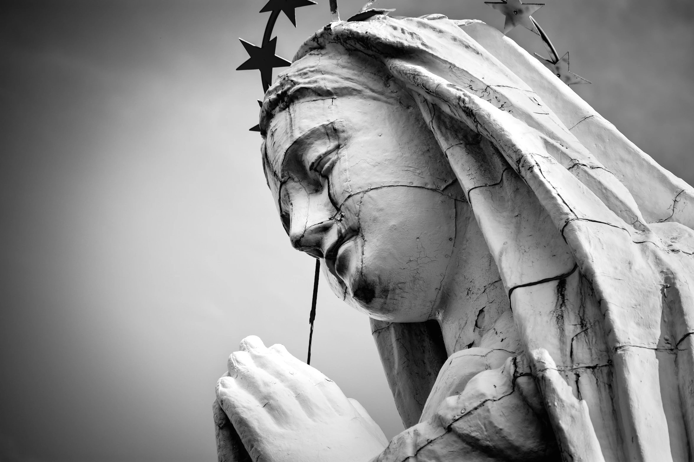 a statue of a religious figure holding a cross