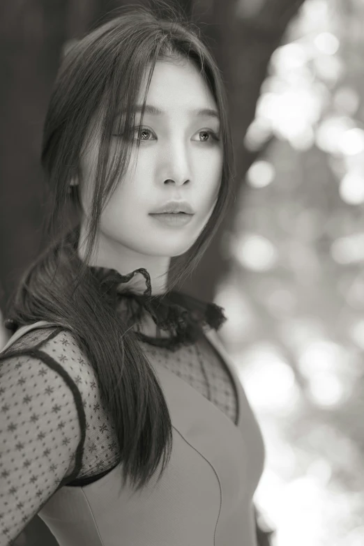 a woman is wearing a blouse and posing for the camera