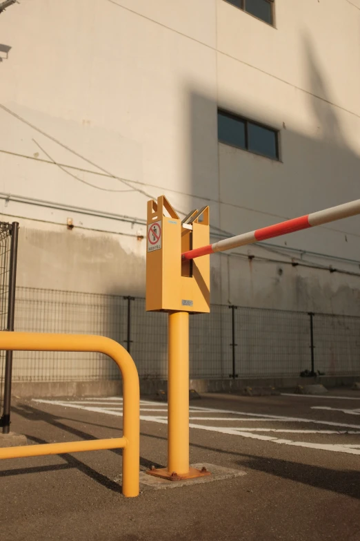 a closed gate is behind a yellow barricade