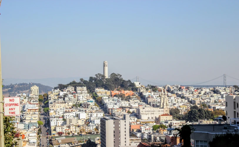 a city view with tall buildings and buildings near the top