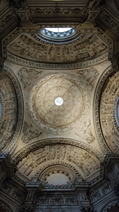a vaulted ceiling with intricate, detailed art