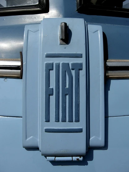 a logo on a blue bus with the word fail painted on it