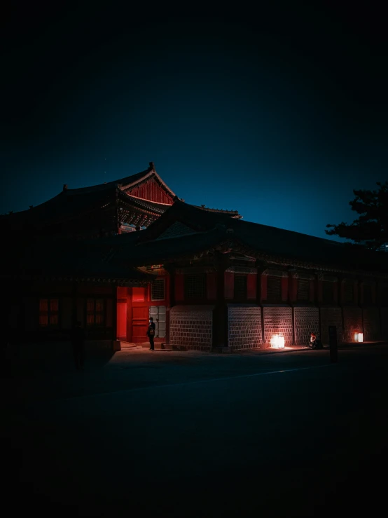 night time po of the building lit up by a red lamp