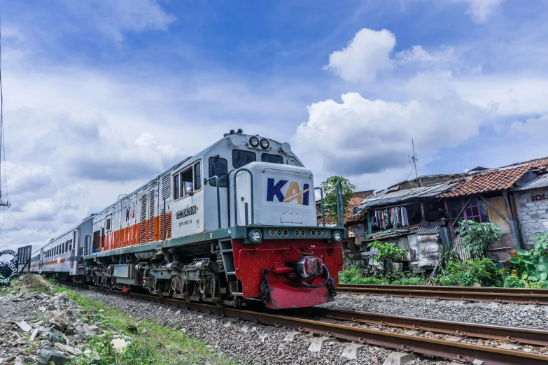 a colorful train is going down some tracks