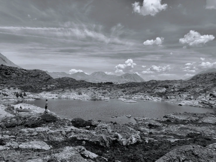 a po taken from a hike of mountains, lake and sky