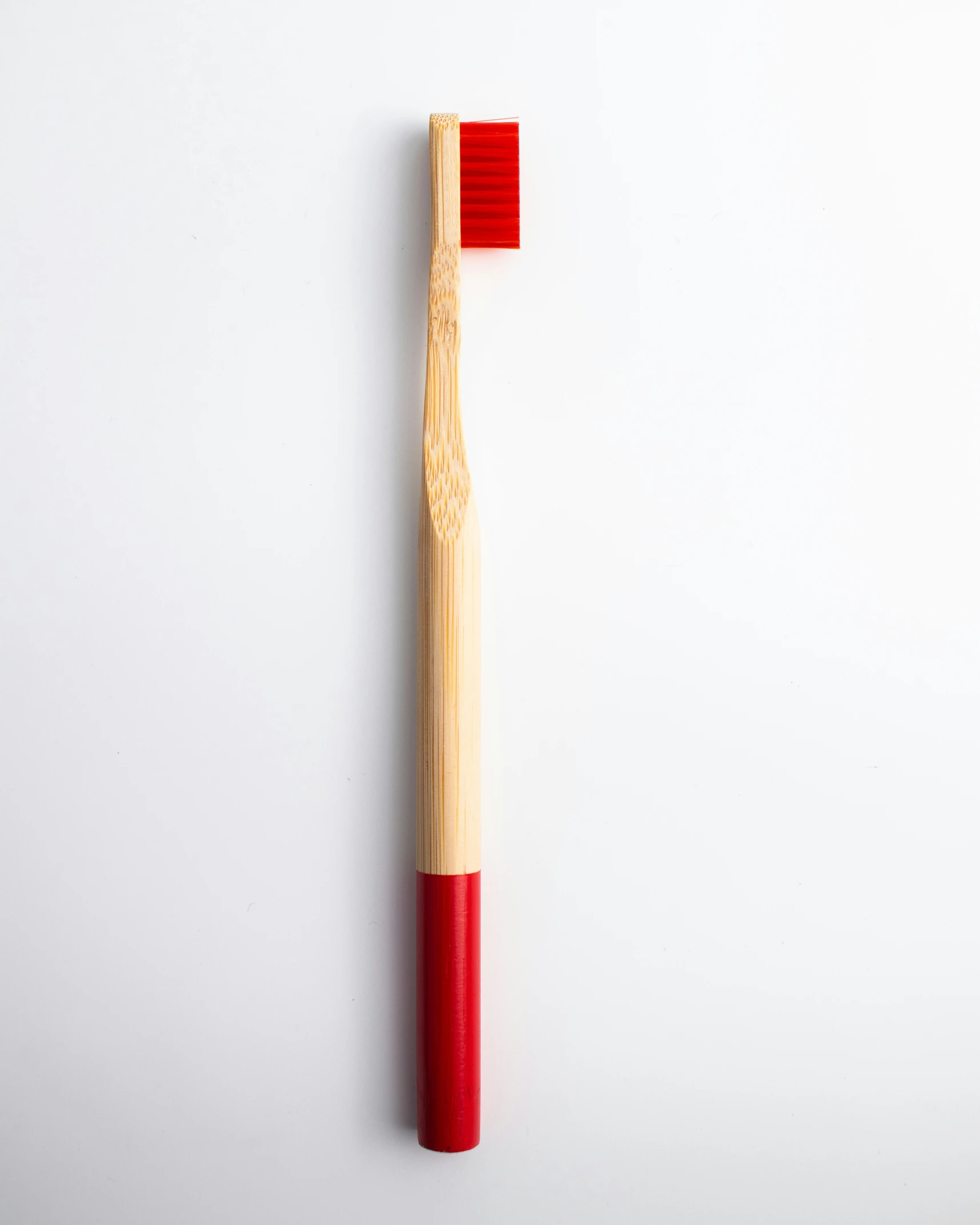 the toothbrush is placed on a table with a white surface