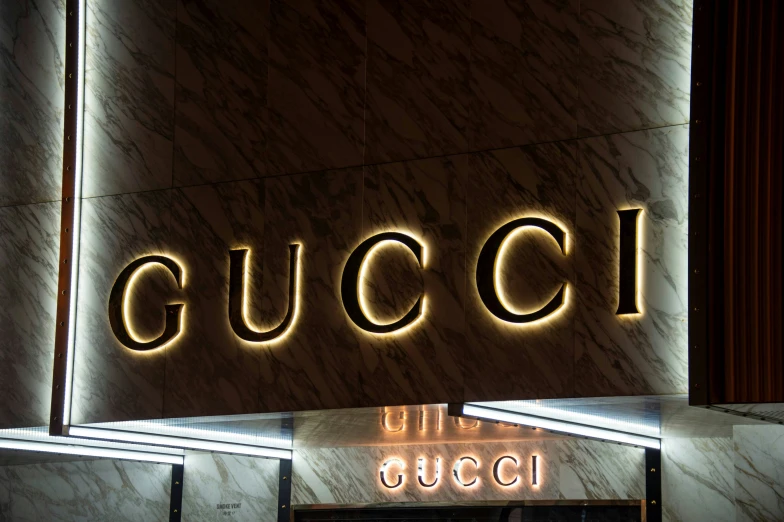 there is a gucci restaurant on a marble wall