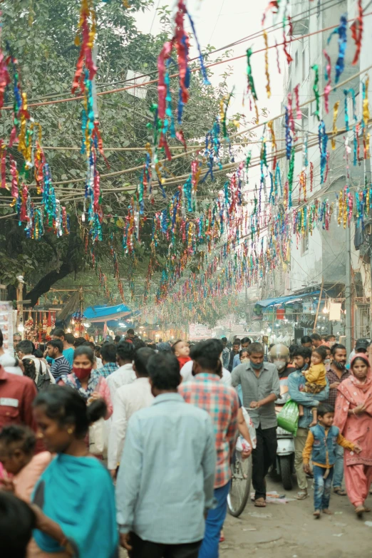 a crowded street scene with many people on it