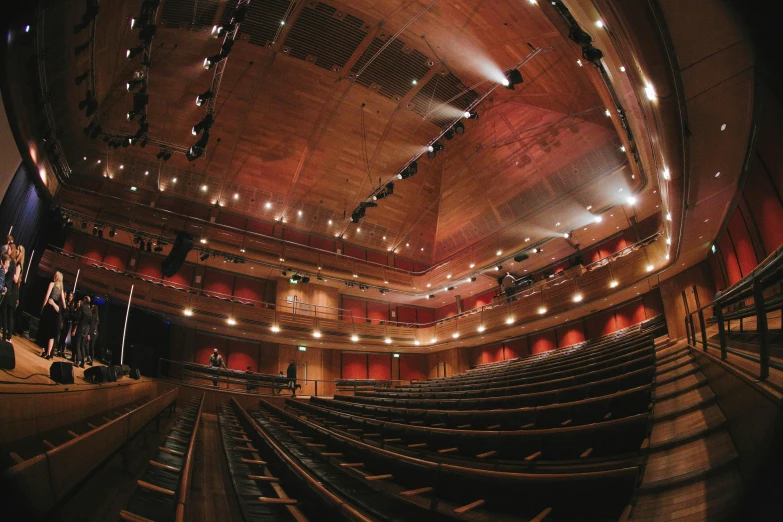 there are some seats in an auditorium for people to see