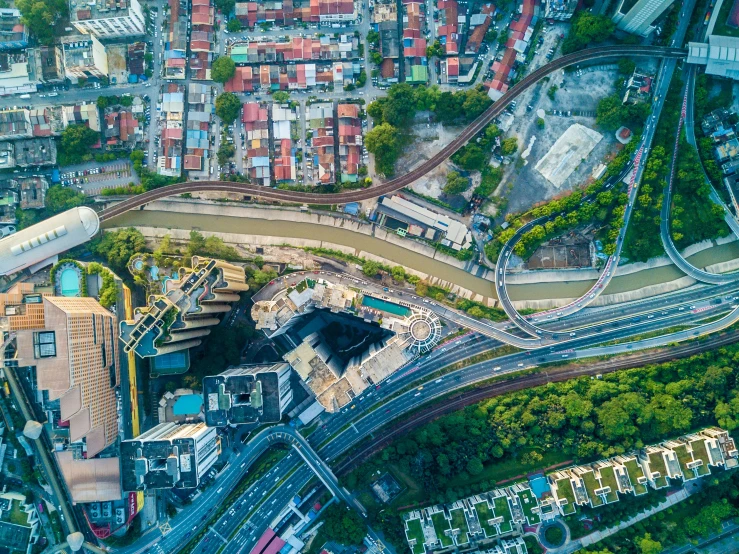 an overhead view of a traffic intersection near a city